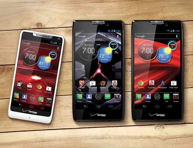 The Droid RAZR M, Droid RAZR HD and Droid RAZR Maxx HD placed on top of a wooded table