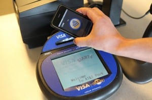 A smartphone making a payment through an NFC enabled terminal